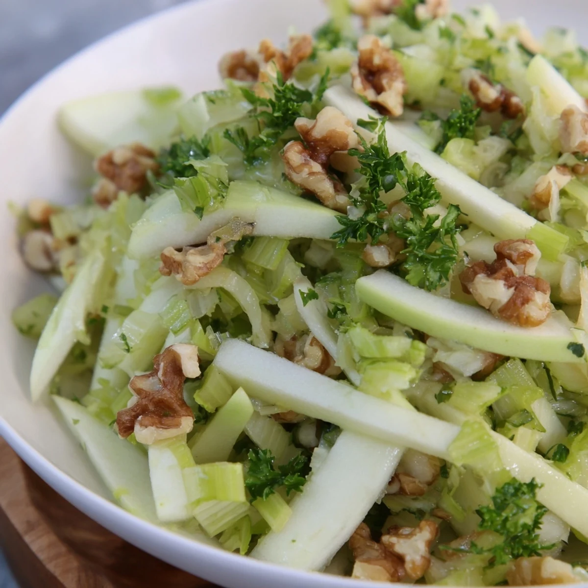 Freshly sliced green apples, crisp celery, and golden toasted walnuts tossed in a tangy dressing for this vibrant Green Apple and Celery Salad with Walnuts.