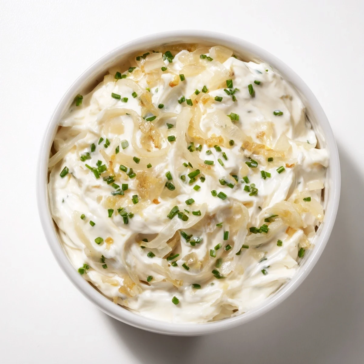 Homemade Game Day Onion Dip in a rustic bowl with a side of sturdy potato chips for dipping.