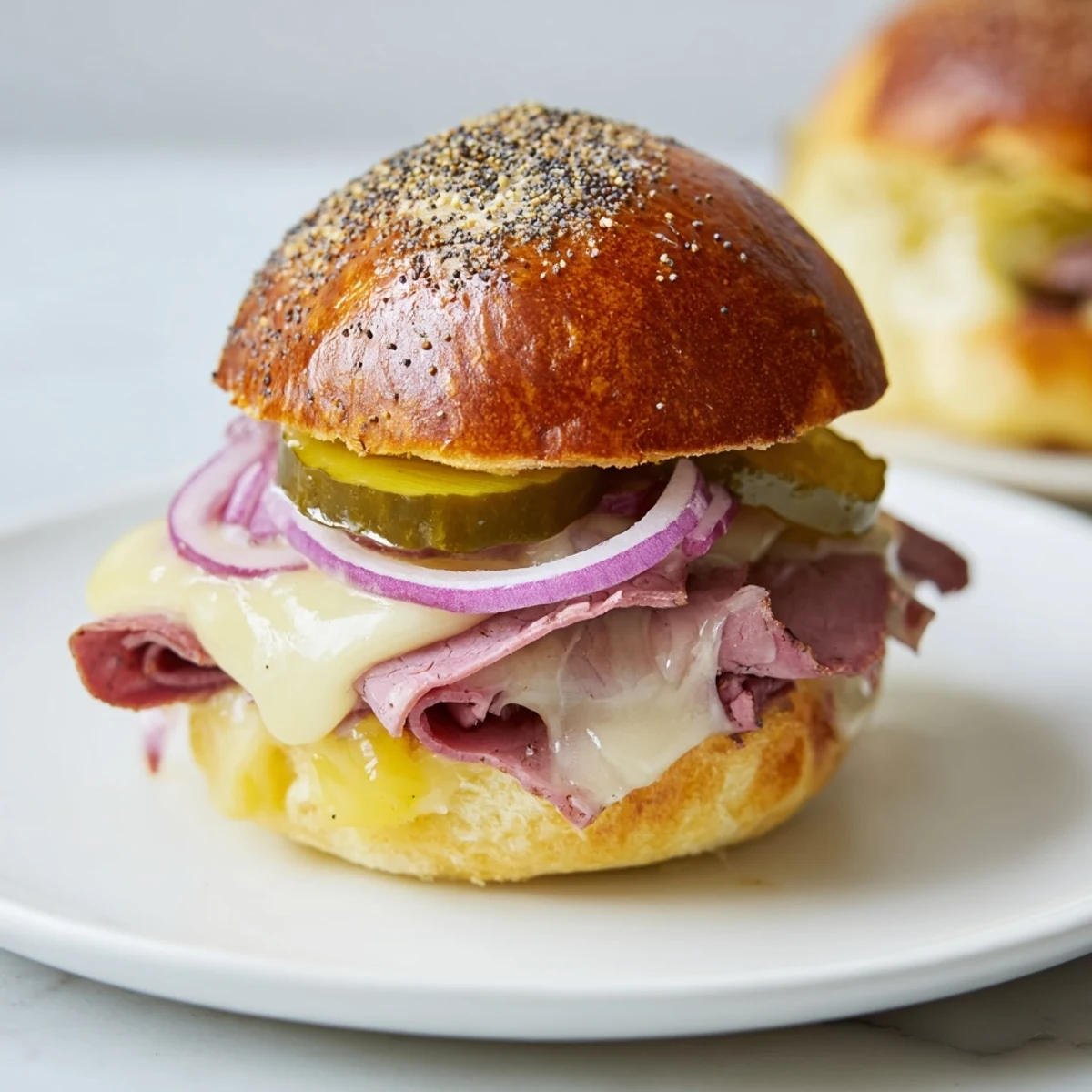 Golden-brown Corned Beef Sliders with Cheese on a platter, with melted Swiss and tangy mustard.