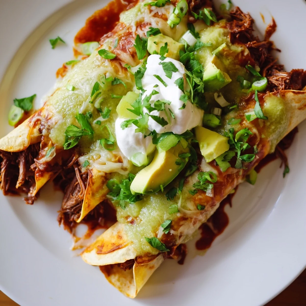 Sizzling hot Beef Enchiladas with Green Sauce just out of the oven for dinner.