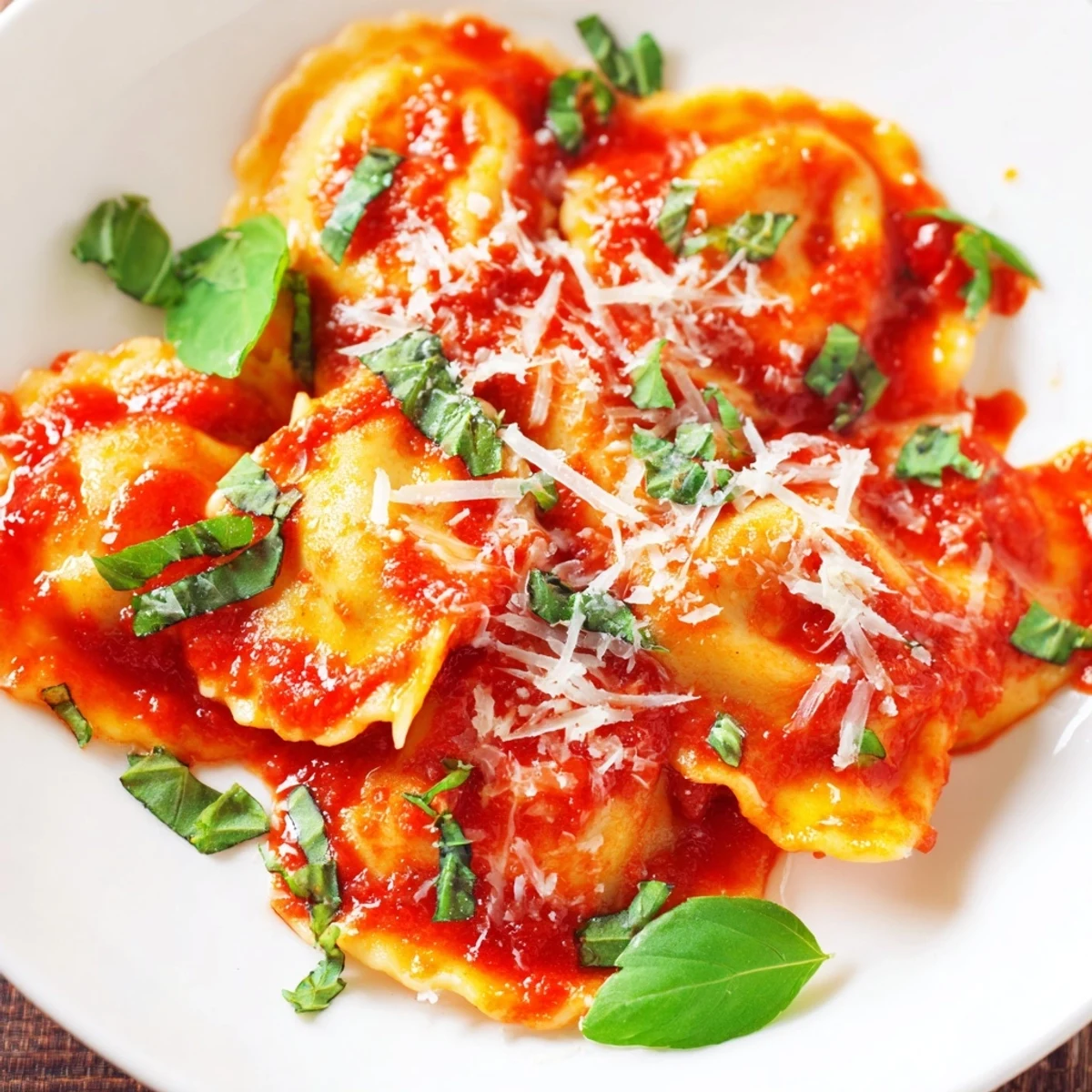 A close-up of 20-Minute Ravioli with Simple Sauce, steaming on a white plate for a weeknight dinner.