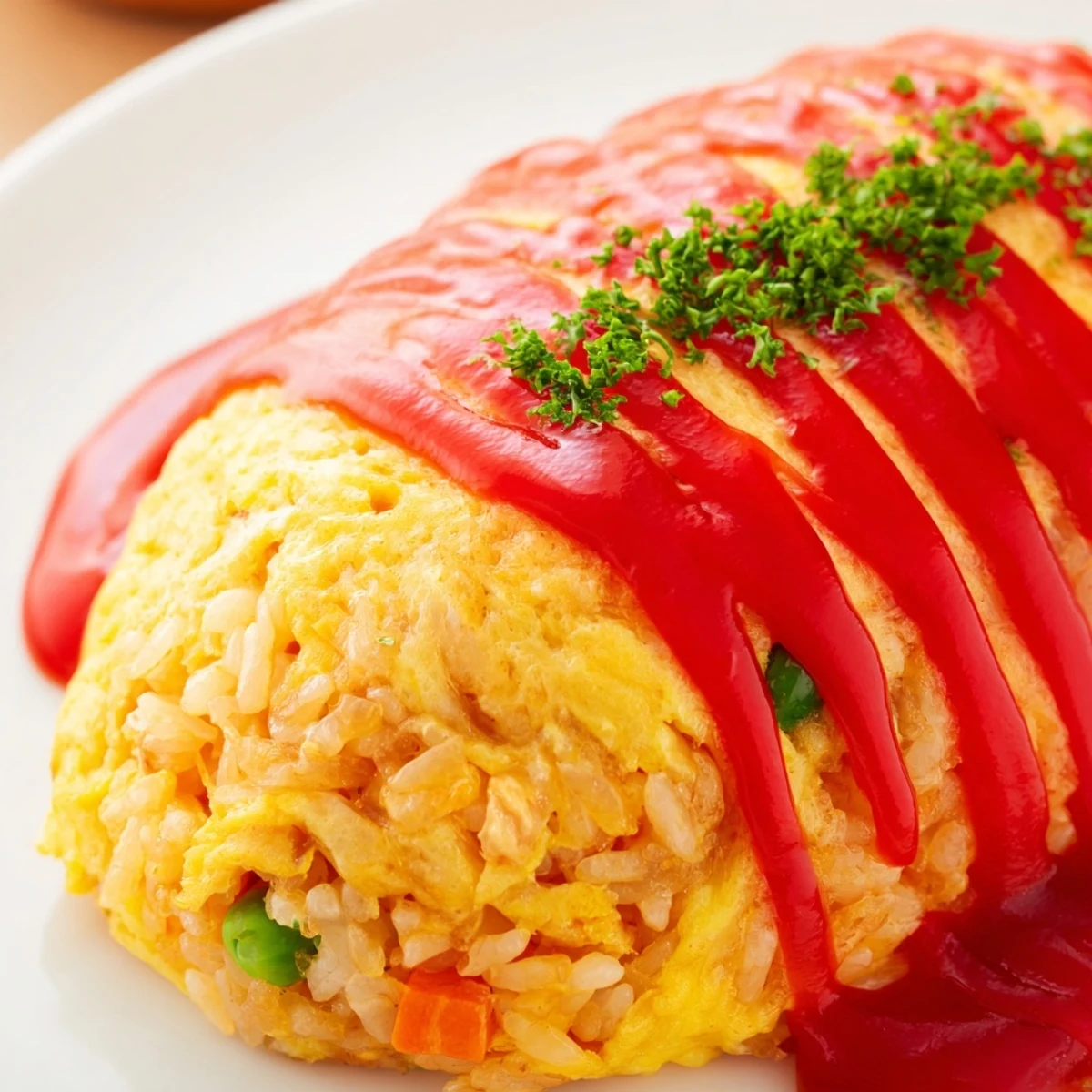 Golden omurice featuring fluffy yellow omelet wrapped around savory ketchup fried rice