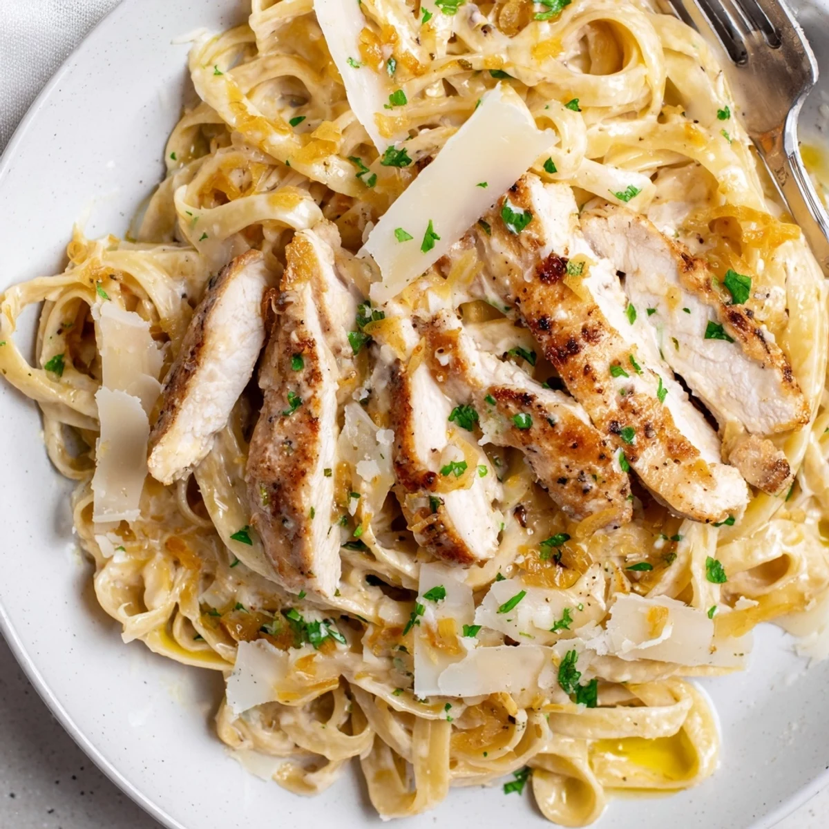 Creamy Garlic Chicken Pasta plated for weeknight dinner, tender chicken, aromatic sauce