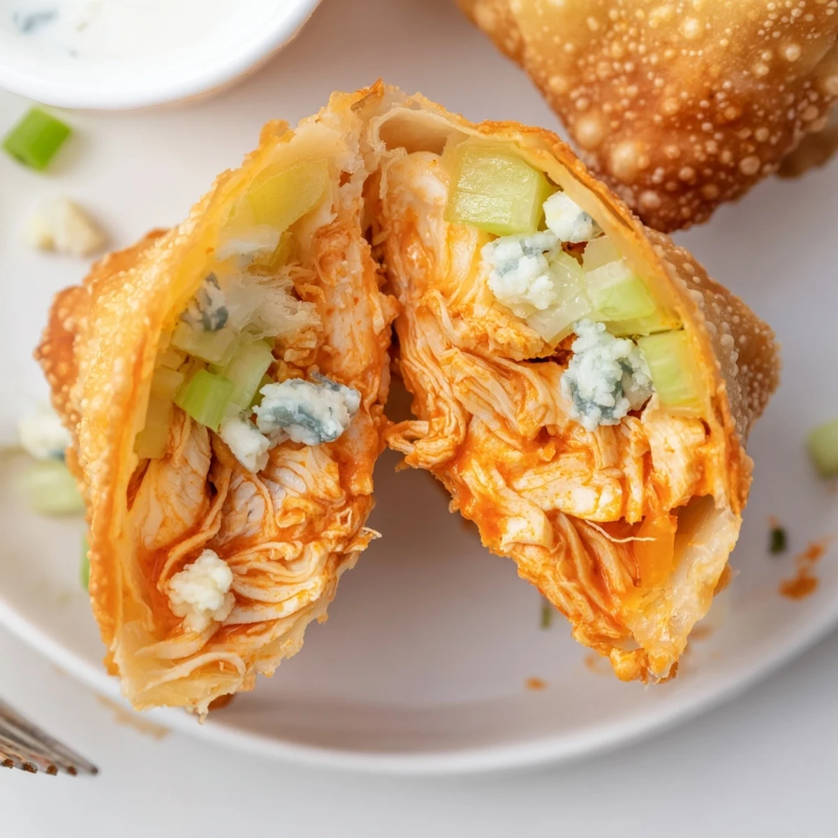 Make-ahead Buffalo Chicken Egg Rolls Recipe, spicy shredded chicken, celery crunch and melty mozzarella