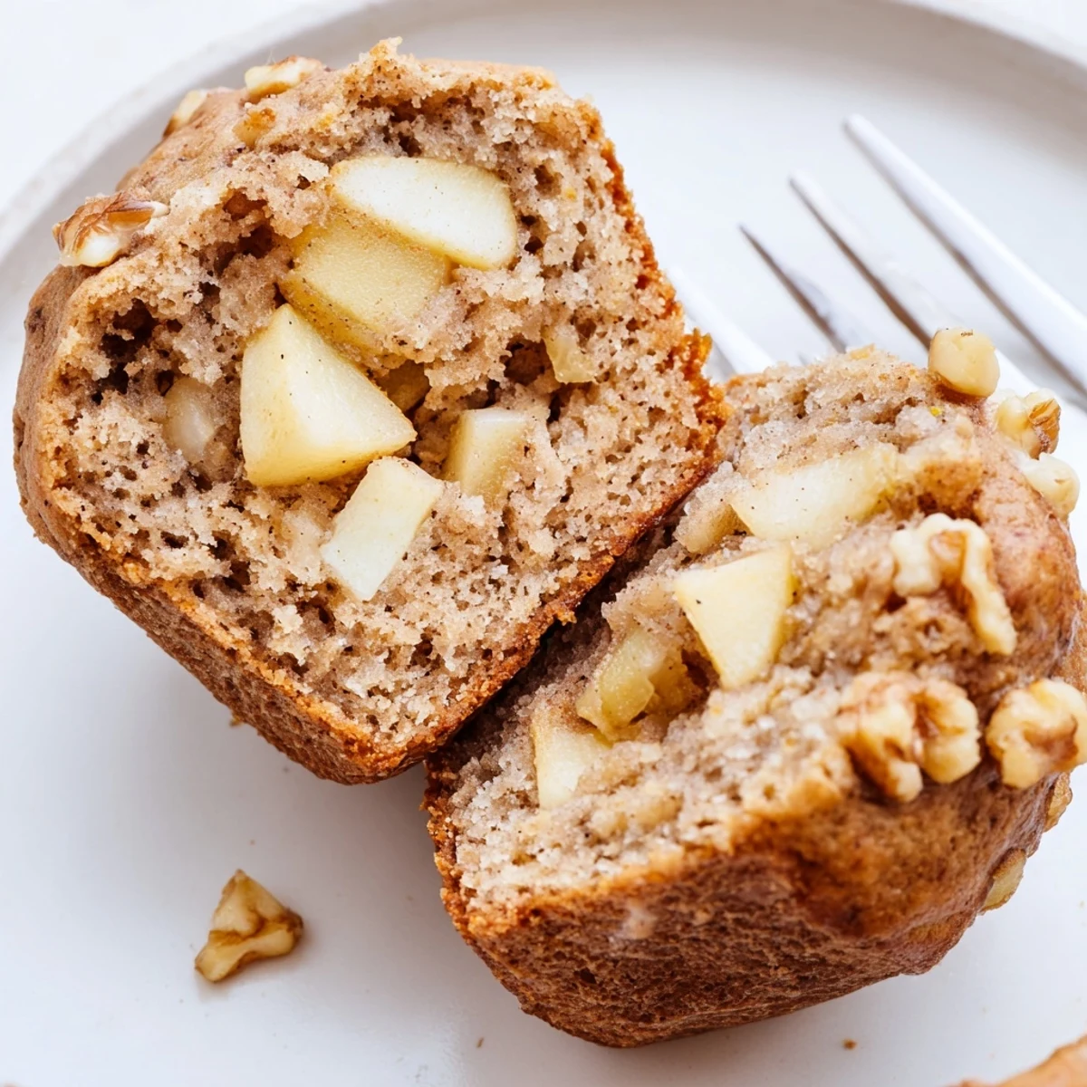 A tray of Healthy Apple Cinnamon Greek Yogurt Muffins, golden tops glistening