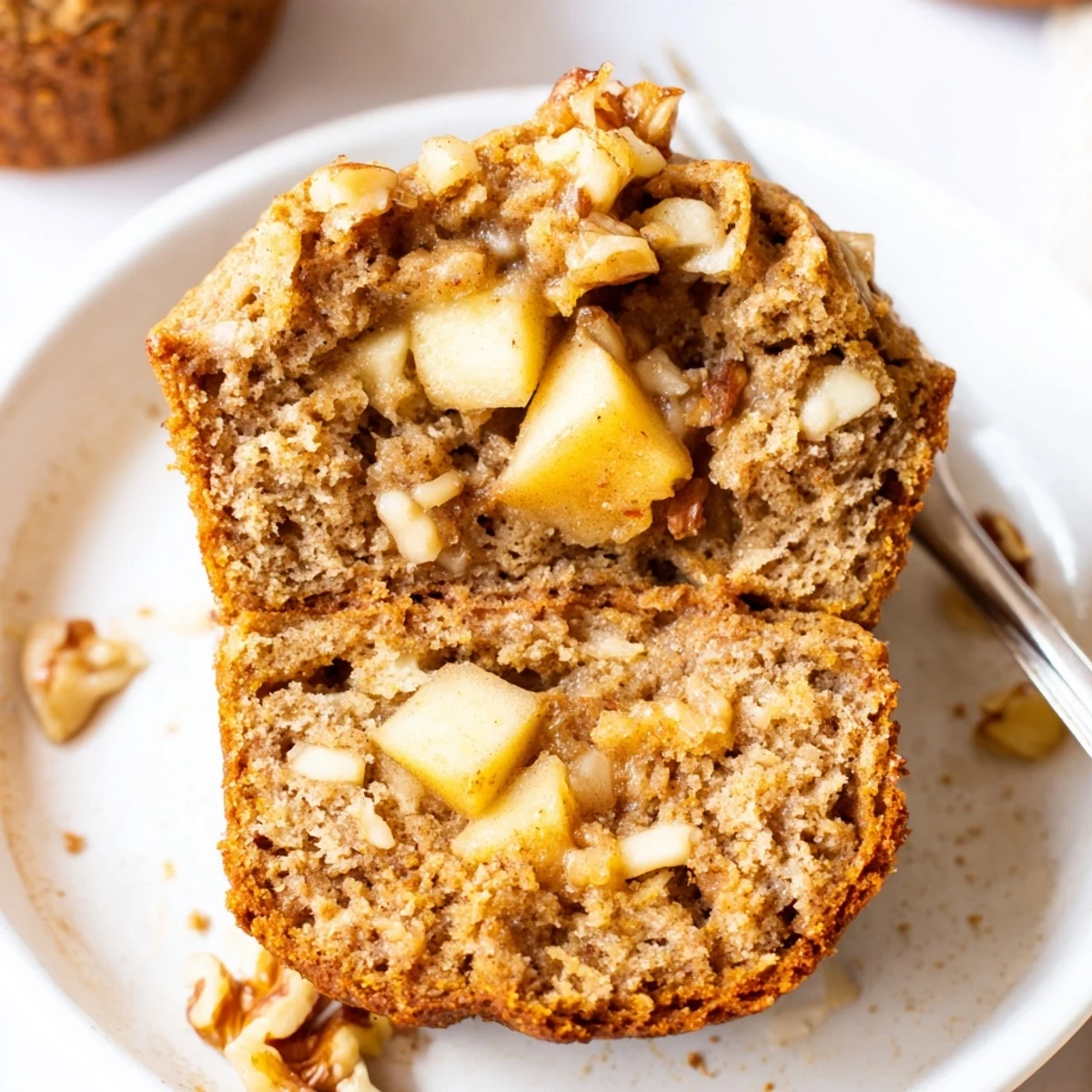 Healthy Apple Cinnamon Greek Yogurt Muffins served with honey drizzle and toasted pecans