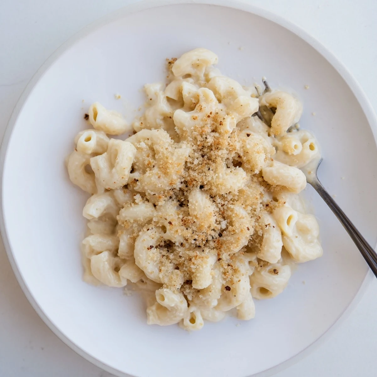 Golden mac and cheese with bubbly cheddar sauce and tender elbow pasta