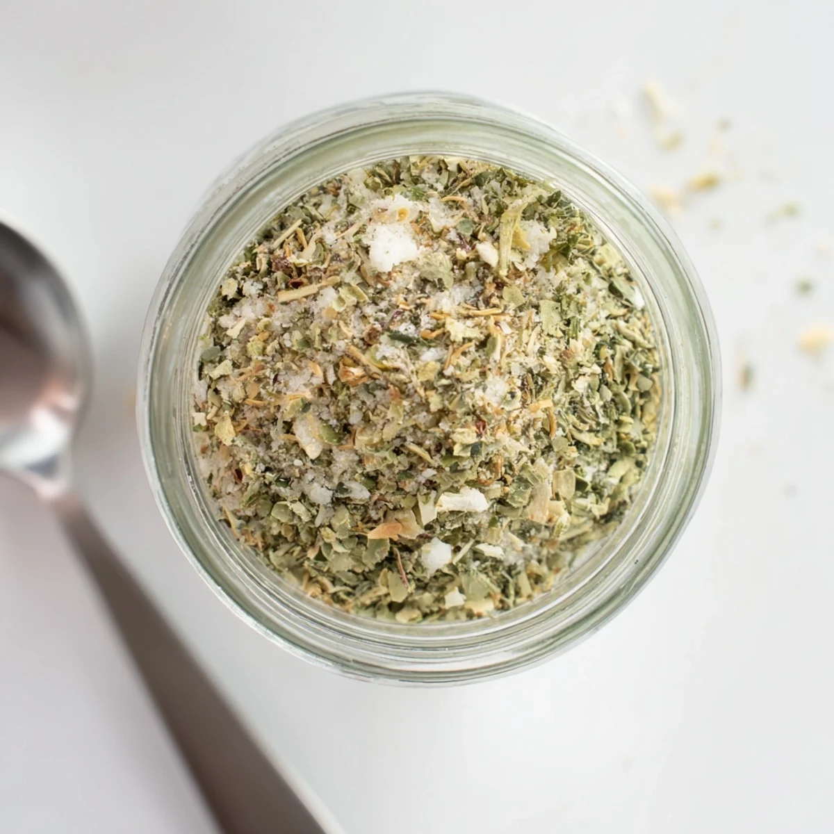 Close-up of Dehydrated Tzatziki Seasoning Mix sprinkled over creamy Greek yogurt dip with fresh herb garnish
