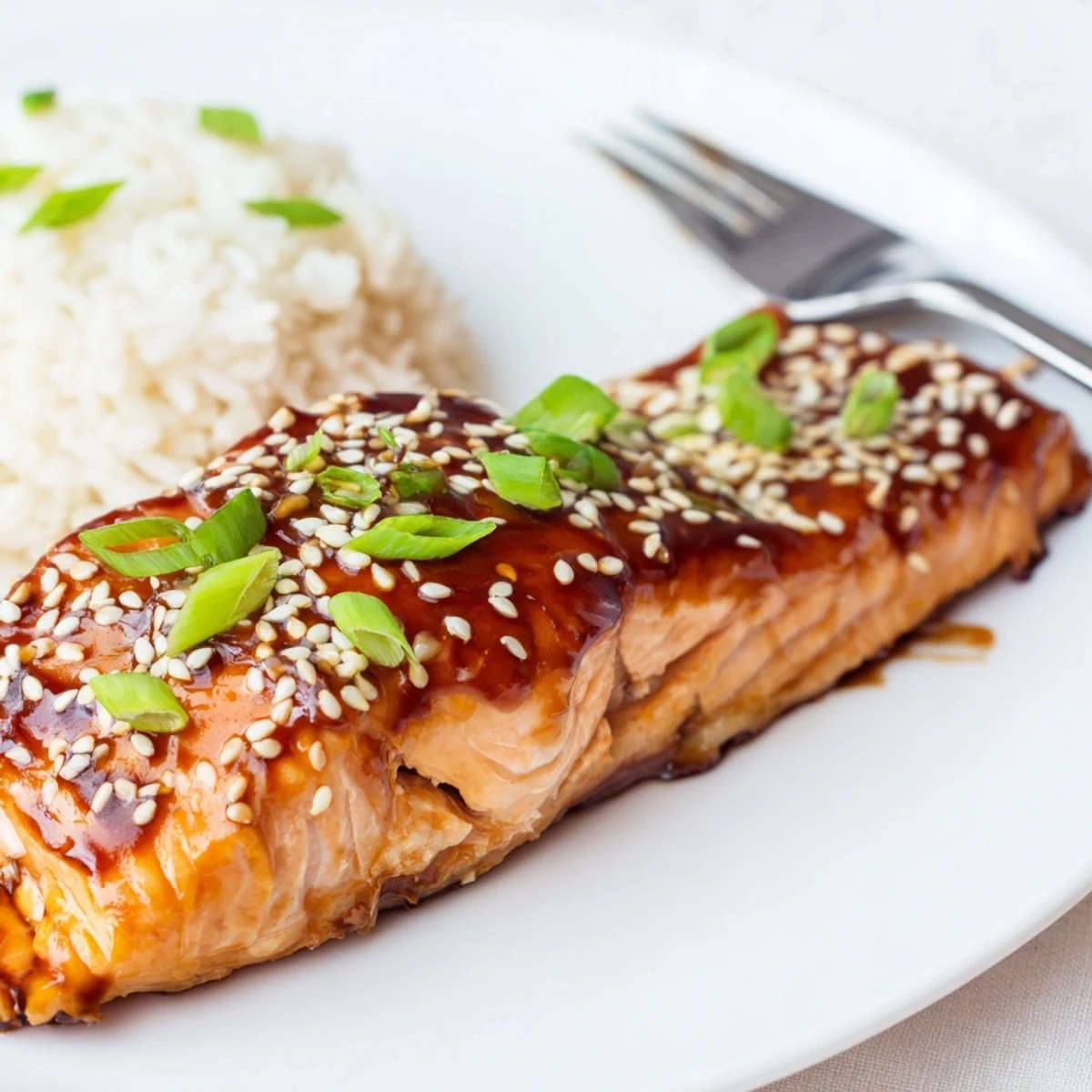 Fork tender Gluten Free Teriyaki Salmon Recipe glazed in maple soy sauce, sesame seeds