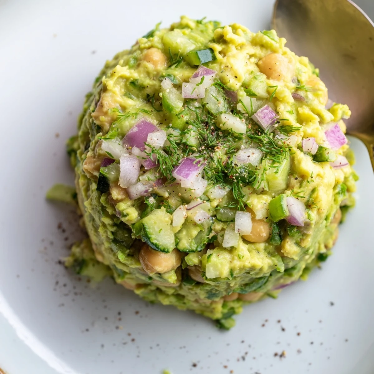 Bright Smashed Chickpea Avocado Pickle piled on toasted bread, tangy and creamy