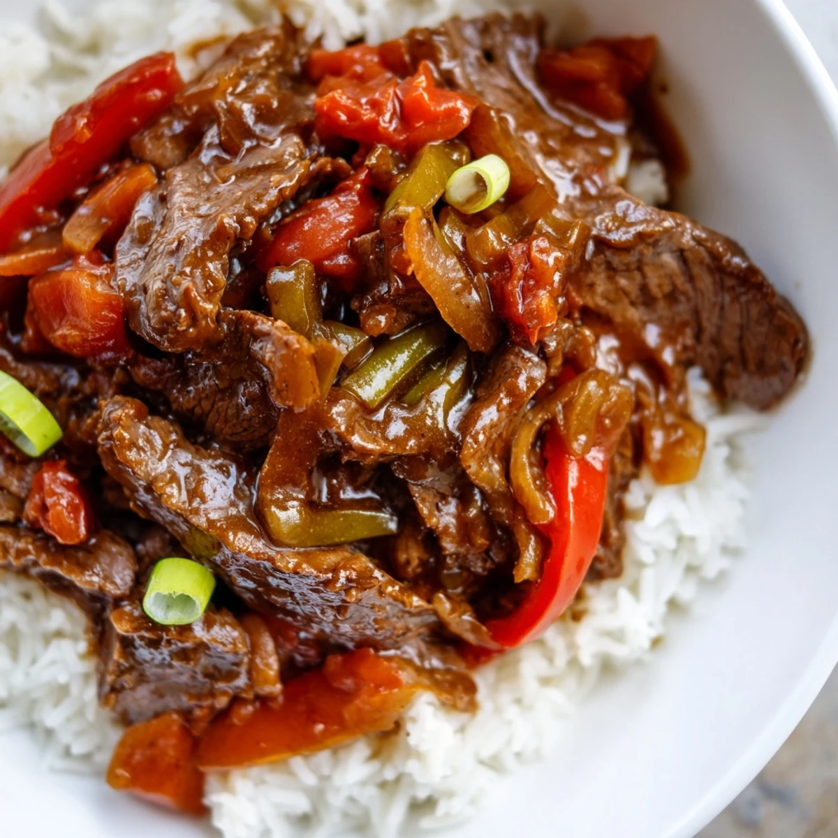 Colorful bell peppers and tender beef in this hearty slow cooker pepper steak dinner
